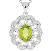 Green peridot sterling silver pendant with accent stones, featuring an elegant floral design.